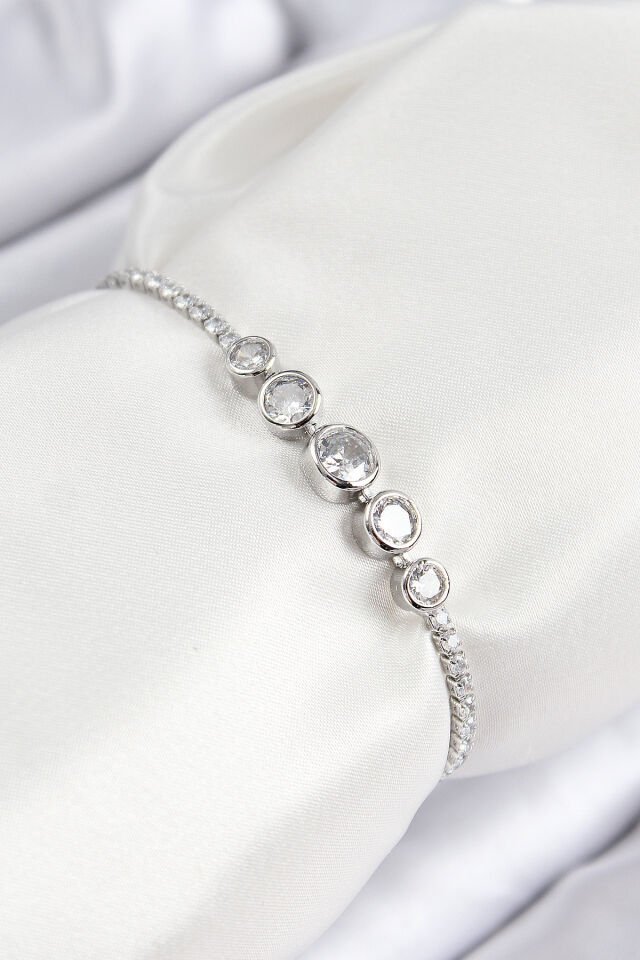 Pirinç Zirkon Taşlı Sıralı Daire Model Gümüş Renk Asansörlü Kadın Bileklik