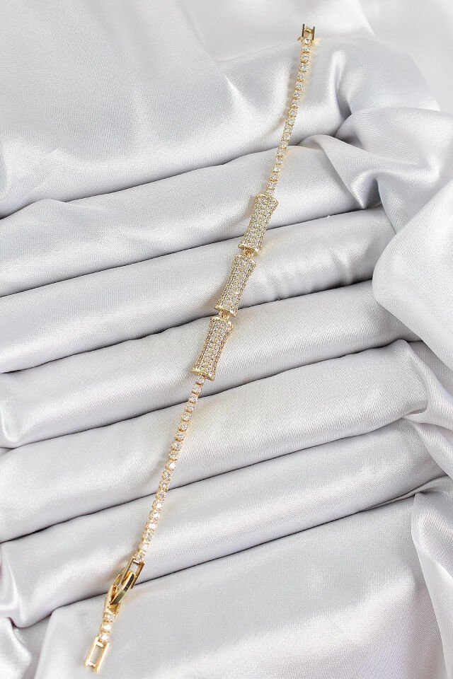 Pirinç Gold Renk Zirkon Taşlı Kemik Model Kadın Bileklik