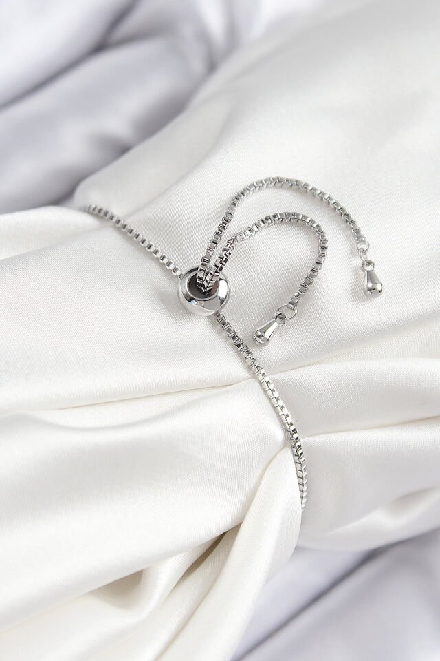 Pirinç Zirkon Taşlı X Detaylı Su Yolu Model Gümüş Renk Asansörlü Kadın Bileklik